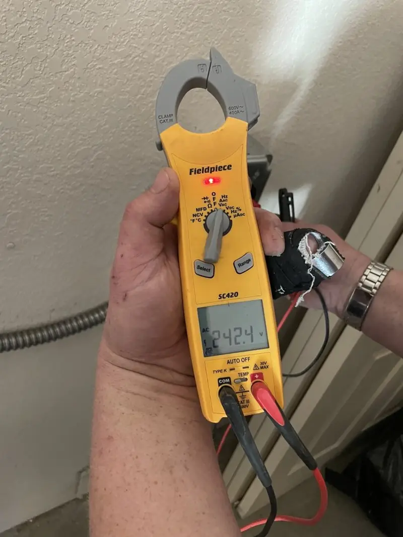 Voltage testing with clamp meter during Electrical Installation Services in Webster